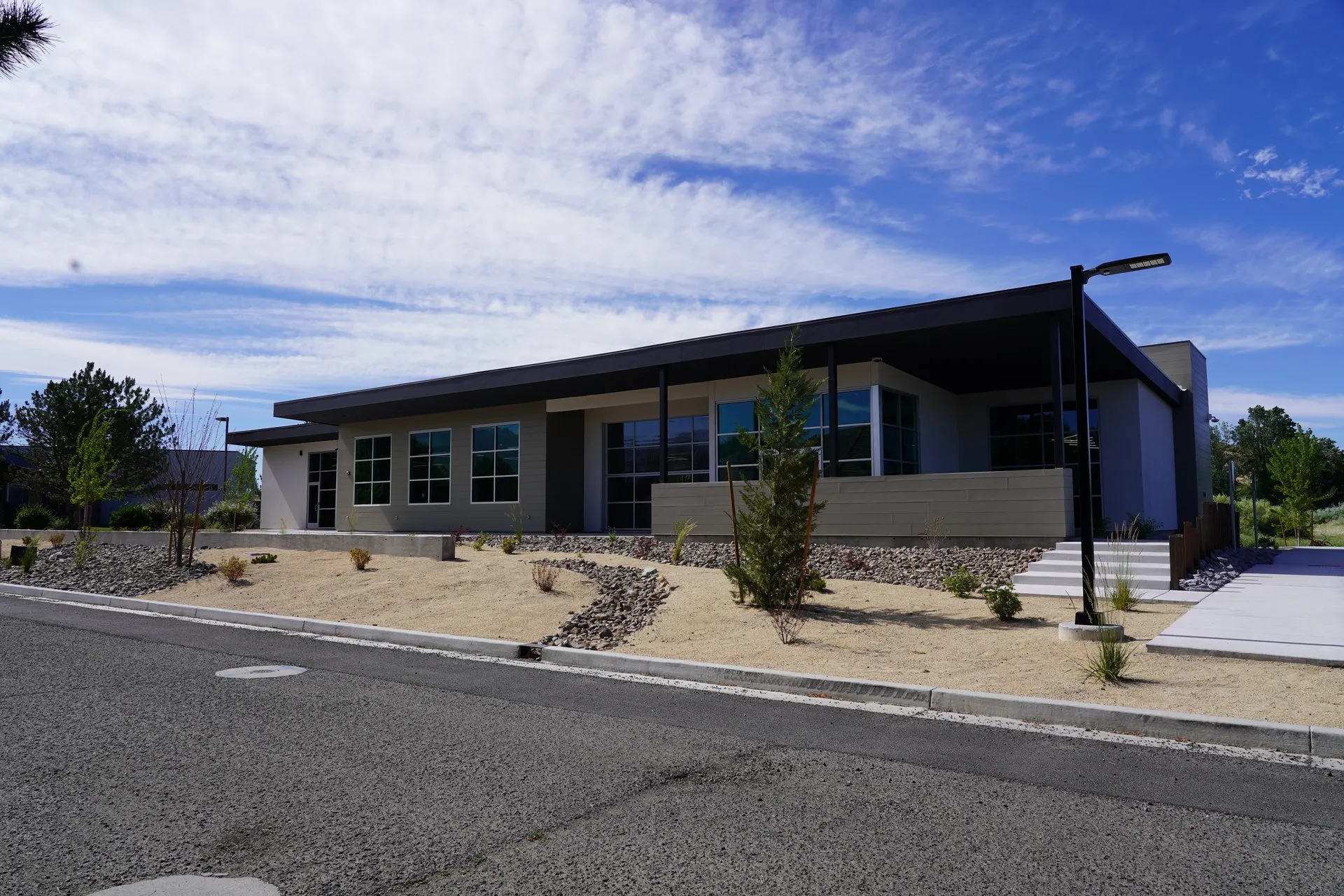 Community building exterior with completed site and access improvements