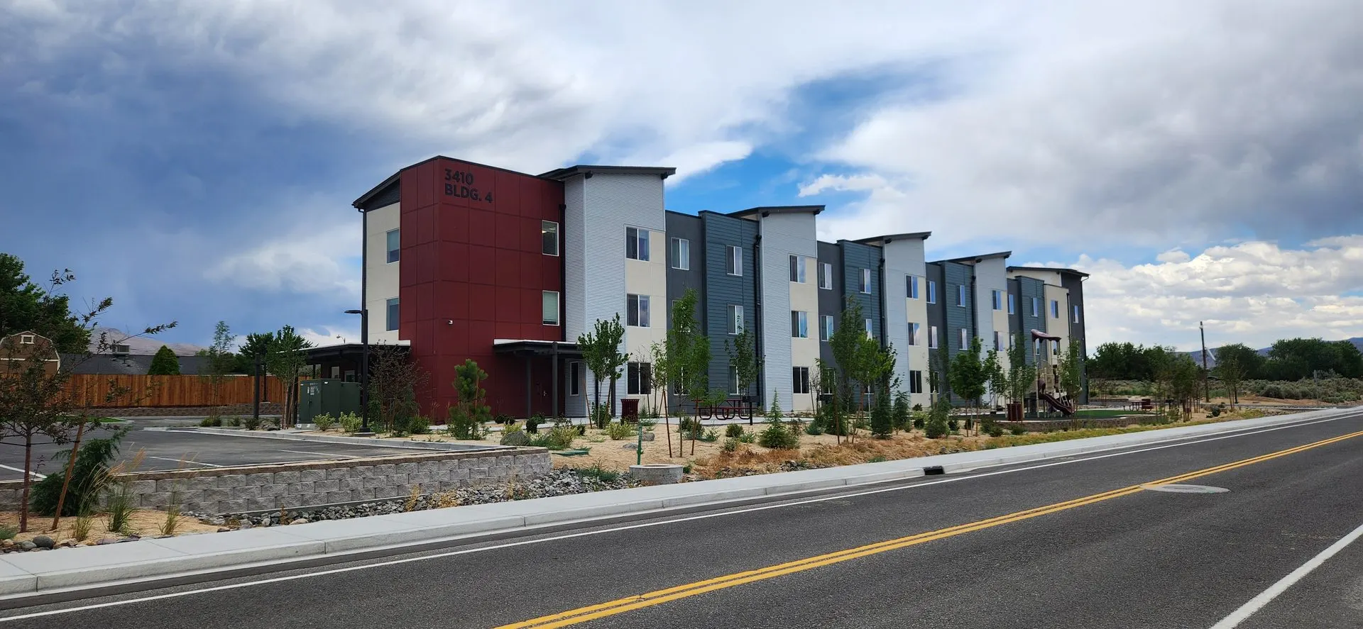 Apartment building street view with completed frontage improvements
