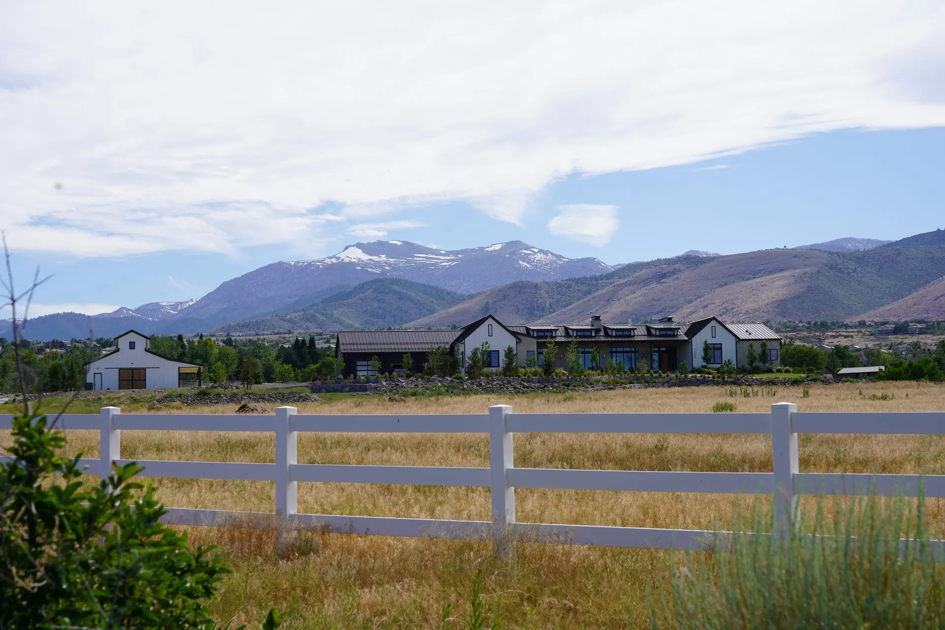 Residential community with mountain views, paved streets, and completed lot grading
